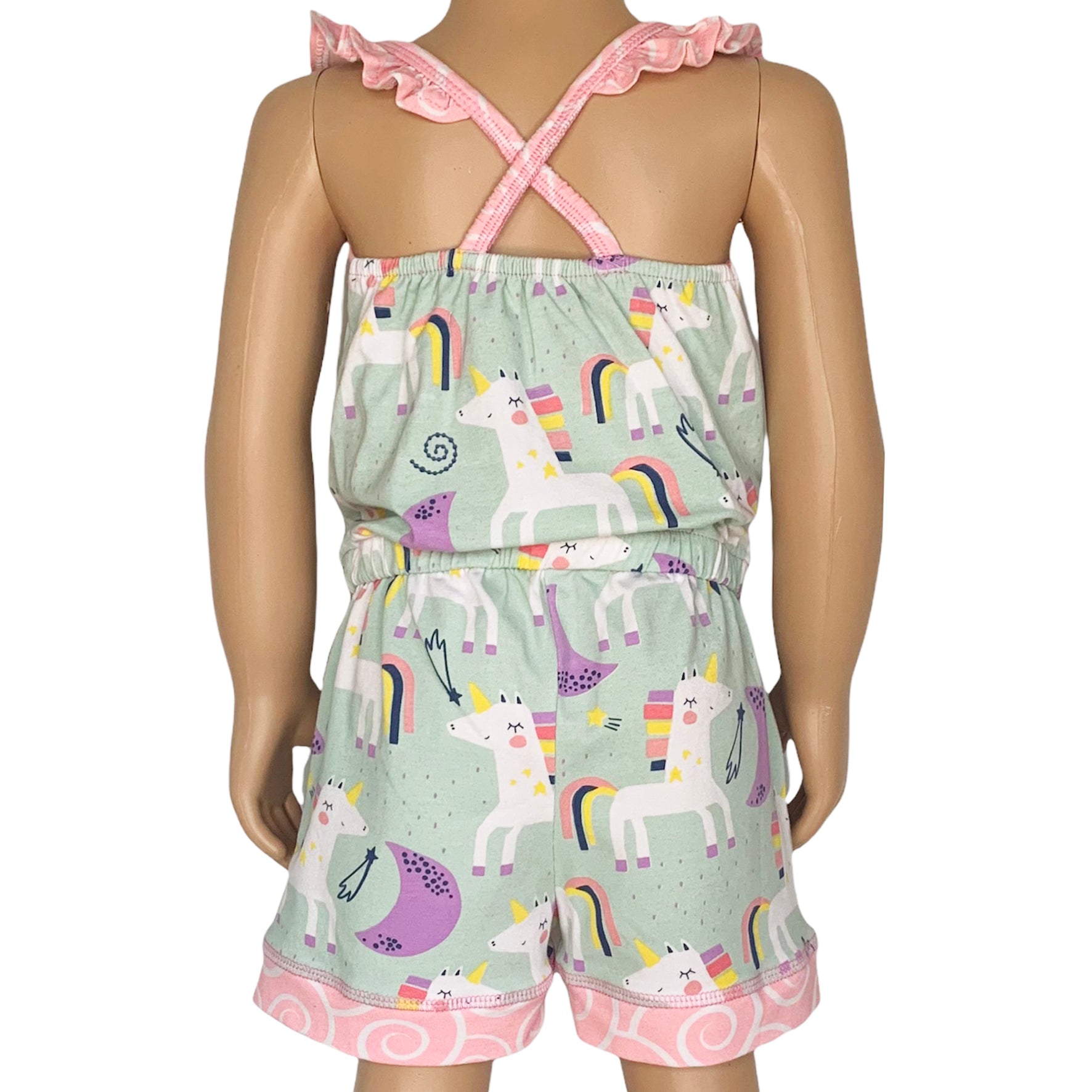 AnnLoren Little & Big Girls Jumpsuit featuring a magical unicorn and rainbow print, with pink swirl ruffle neckline and criss-cross straps.